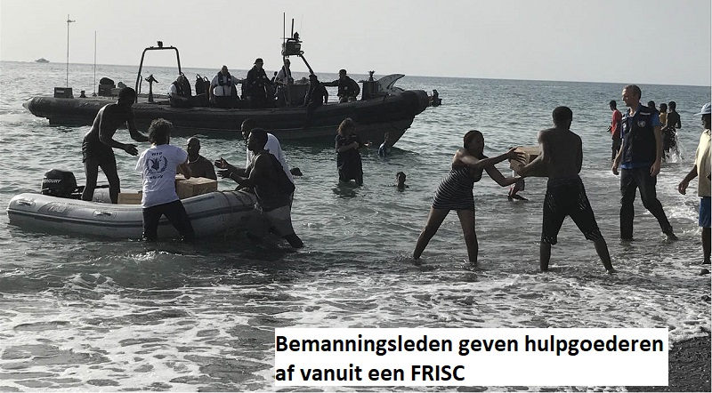 bemanningsleden geven hulpgoederen af via frisc a